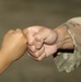Fist bumps all the rage among Afghan children, American Soldiers in Qatar