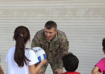 Fist bumps all the rage among Afghan children, American Soldiers in Qatar