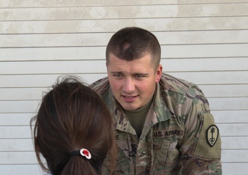 Fist bumps all the rage among Afghan children, American Soldiers in Qatar