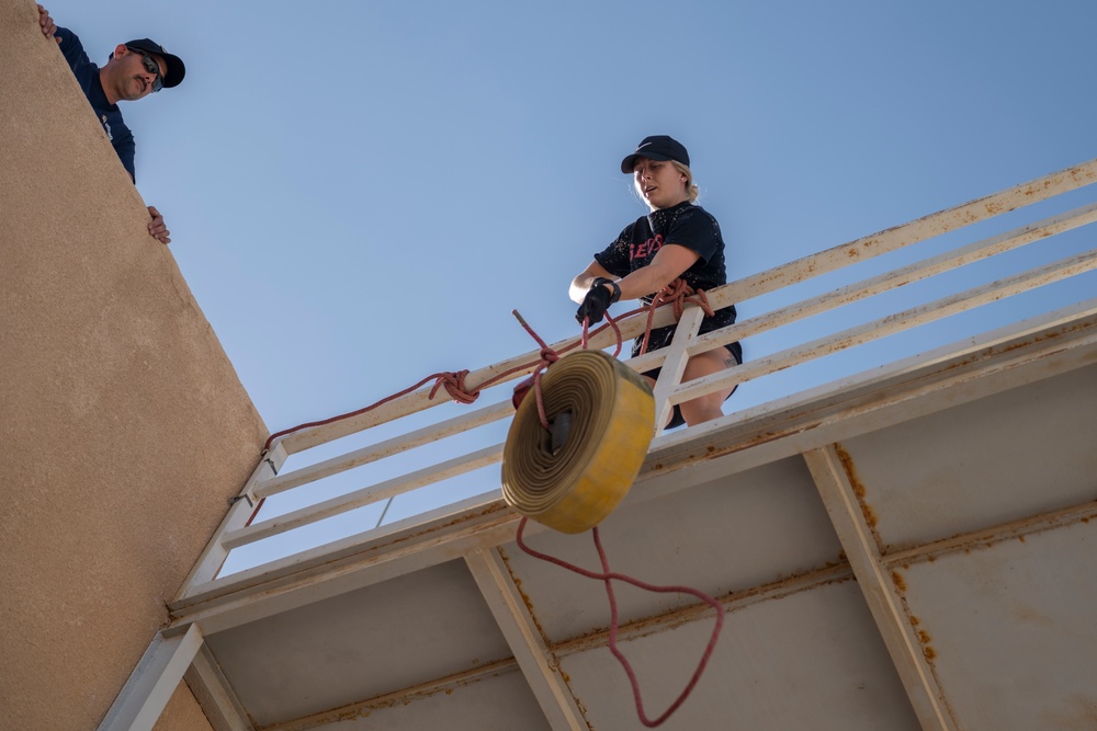 332nd AEW firefighters run obstacle course