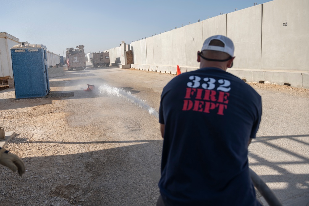 332nd AEW firefighters run obstacle course