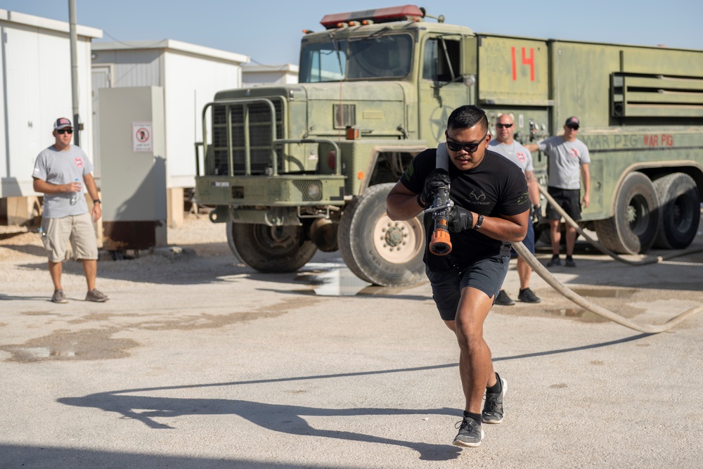 332nd AEW firefighters run obstacle course