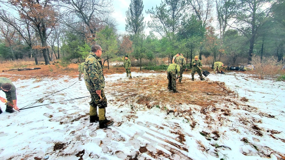 Marines practice building Arctic tent as part of CWOC Class 22-01 training