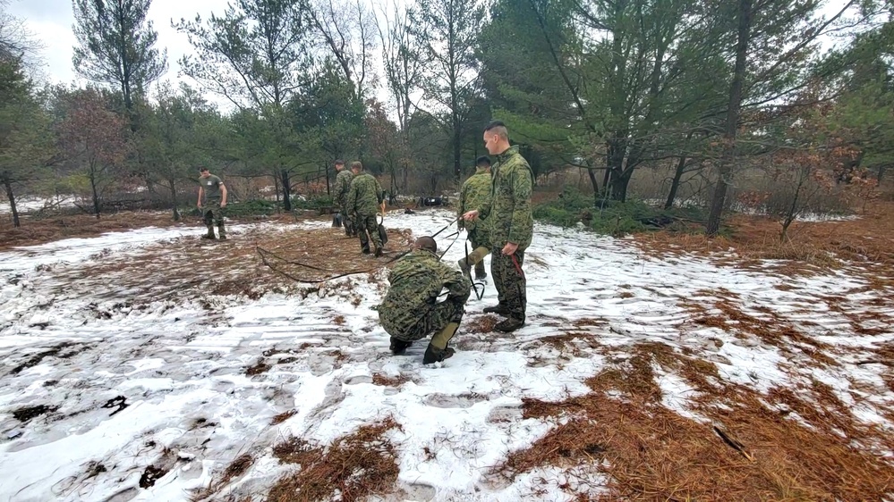 Marines practice building Arctic tent as part of CWOC Class 22-01 training