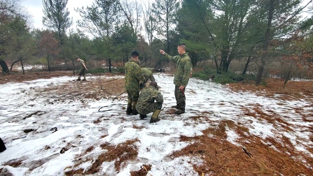 Marines practice building Arctic tent as part of CWOC Class 22-01 training