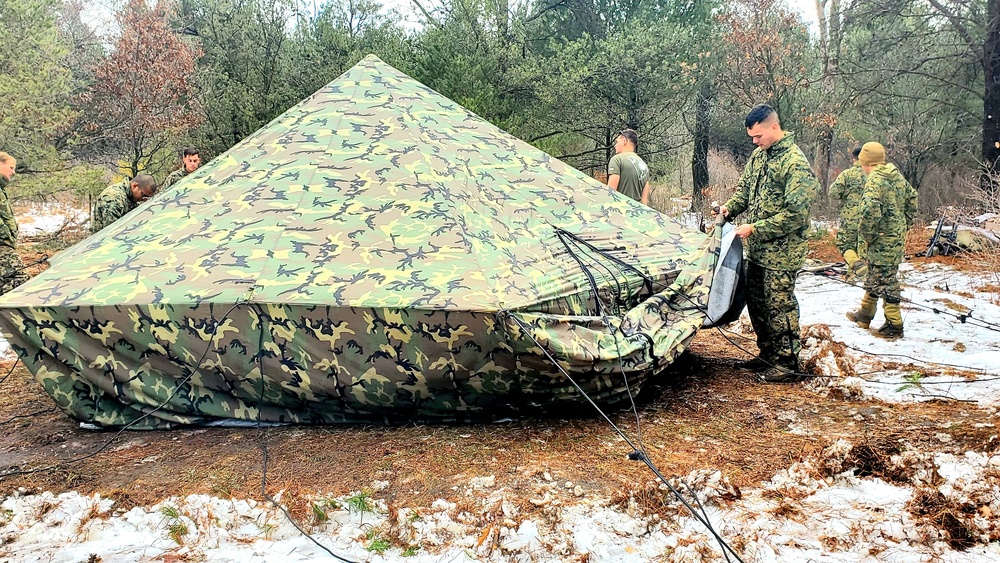 Marines practice building Arctic tent as part of CWOC Class 22-01 training