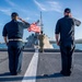 USS Charleston Sailors Observe Morning Colors
