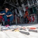 USS Charleston Sailor Conducts Maintenance on Equipment
