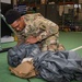 10th SFG riggers pack and inspect parachutes