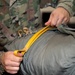 10th SFG riggers pack and inspect parachutes