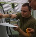 Structurally sound: Aircraft Maintenance Airmen apply a decal