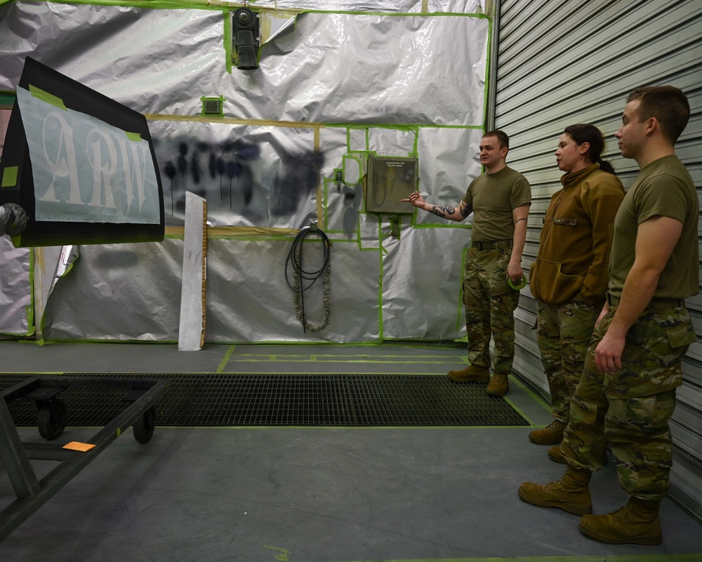 Structurally sound: Aircraft Maintenance Airmen apply a decal