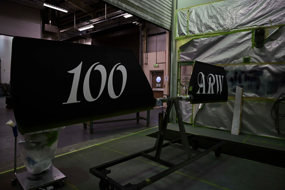 Structurally sound: Aircraft Maintenance Airmen apply a decal