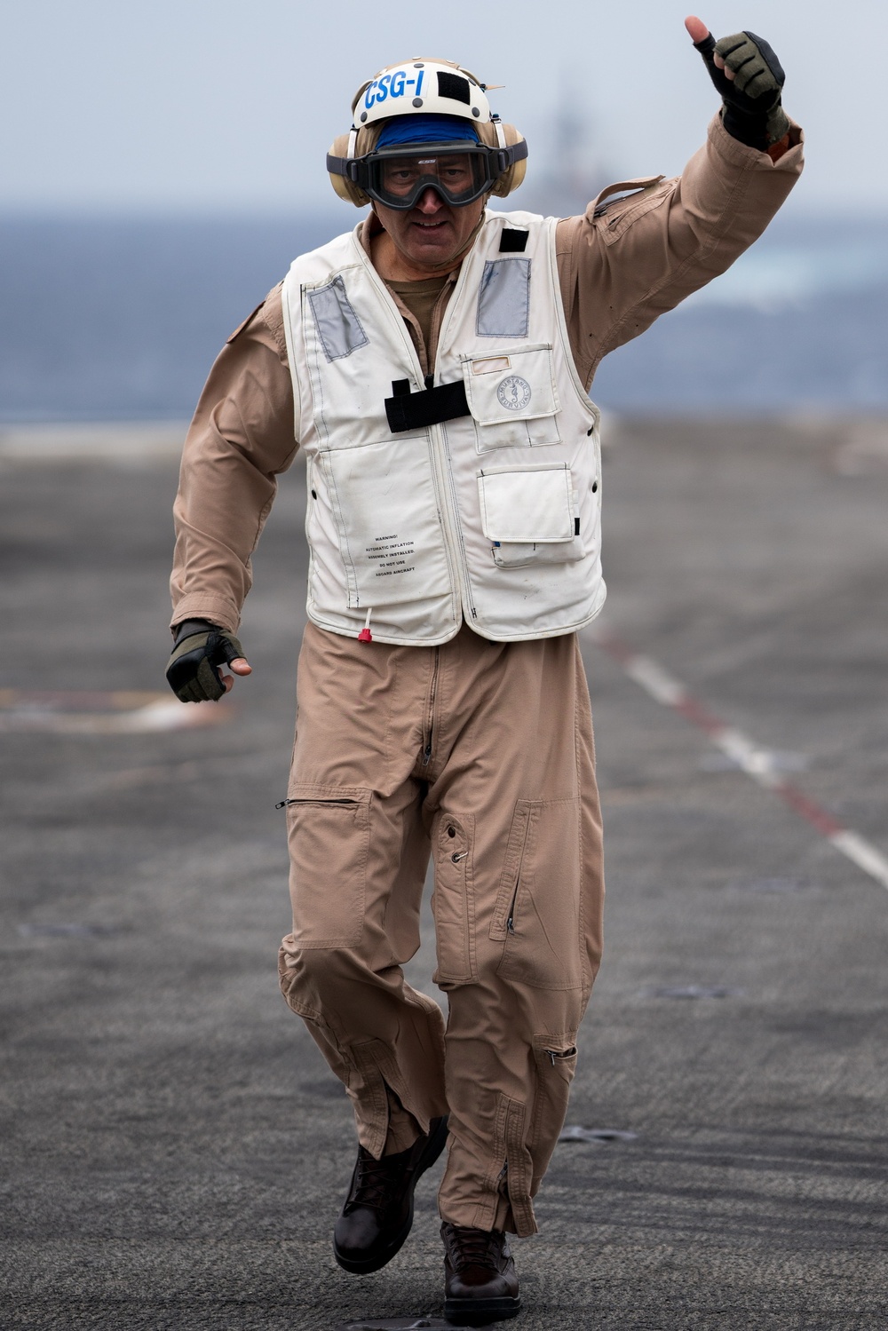 Commander Carrier Strike Group 1 takes part in vertical replenishment.