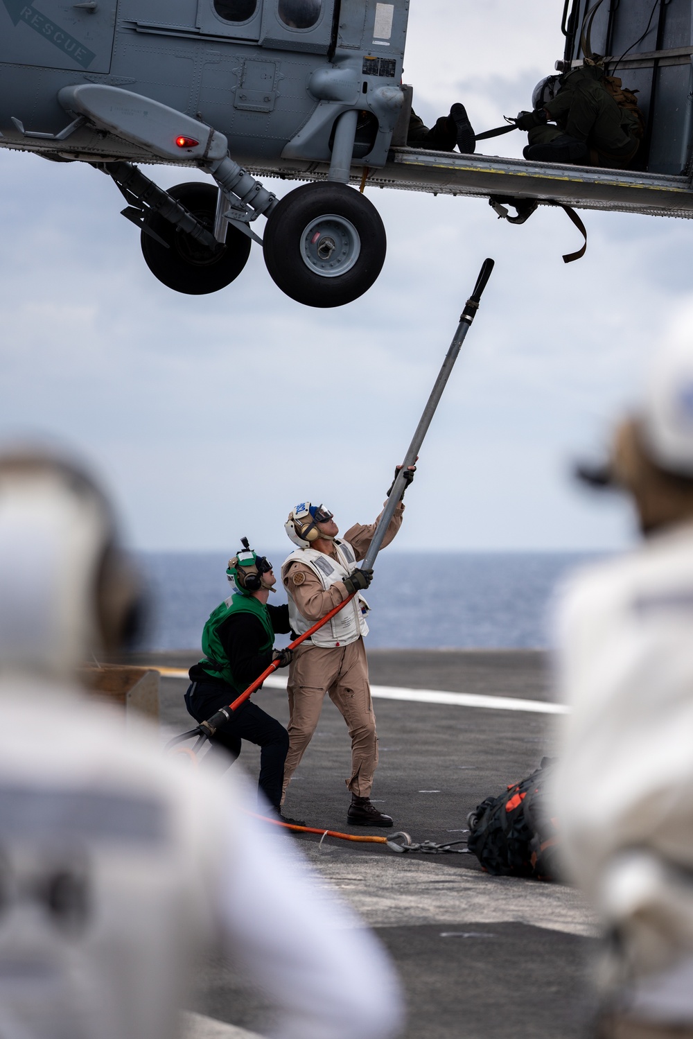 Commander Carrier Strike Group 1 goes hands-on in vertical replenishment.