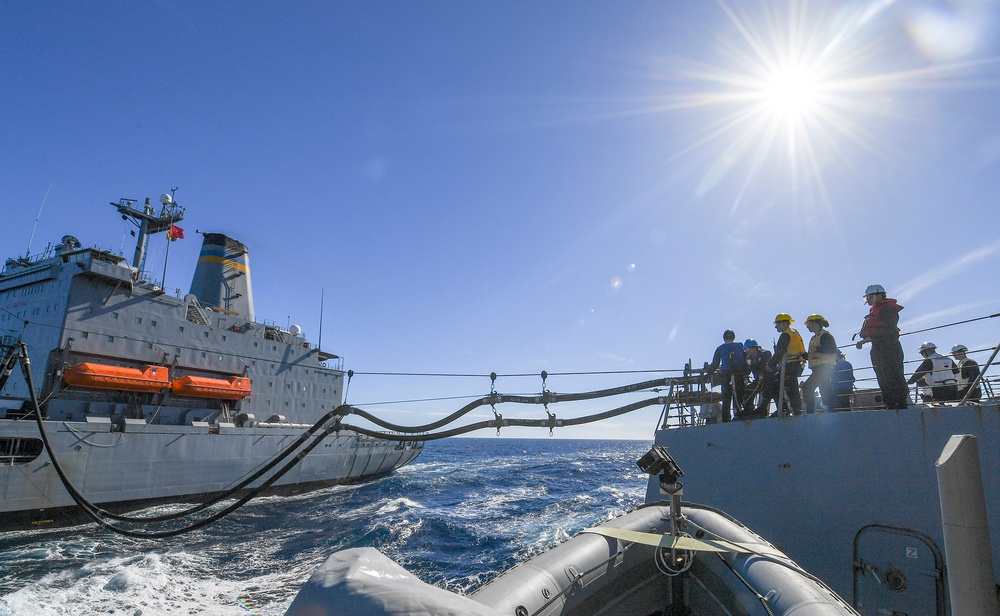 USS Chafee (DDG 90) Conducts A Replenishment-At-Sea In South China Sea