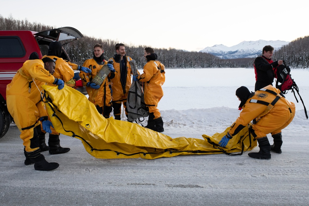 JBER fire protection specialists conduct ice rescue training