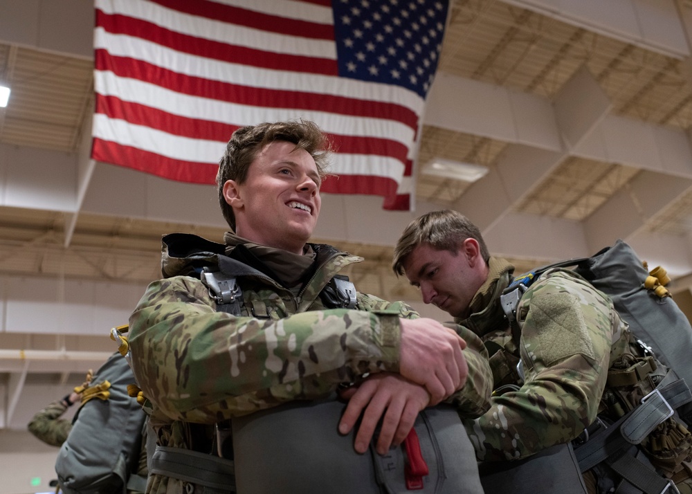 Air Force tactical air control party specialists and combat weather airmen prepare for airborne operations at JBER