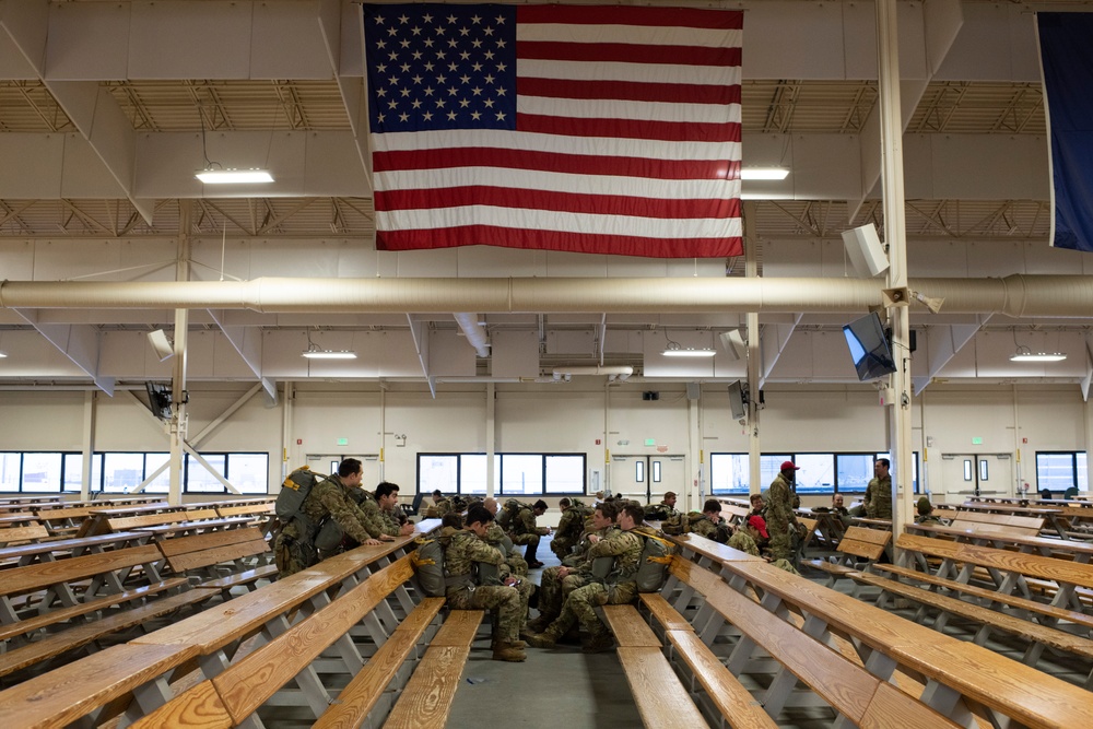 Air Force tactical air control party specialists and combat weather airmen prepare for airborne operations at JBER