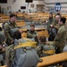 Air Force tactical air control party specialists and combat weather airmen prepare for airborne operations at JBER