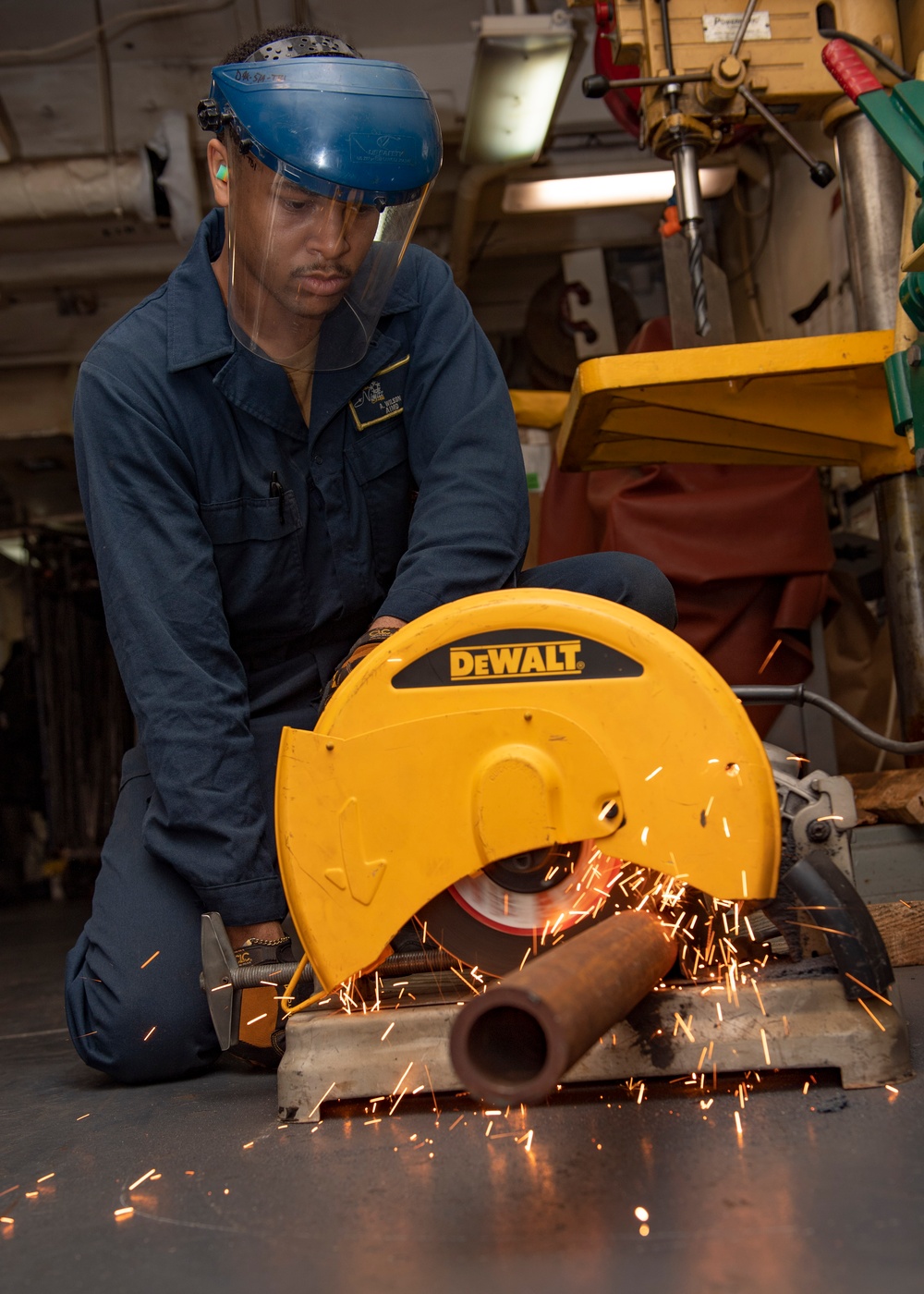 Sailor Cuts Steel Pipe