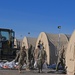 Task Force Holloman Airmen remove sand bags from the Life Support Area