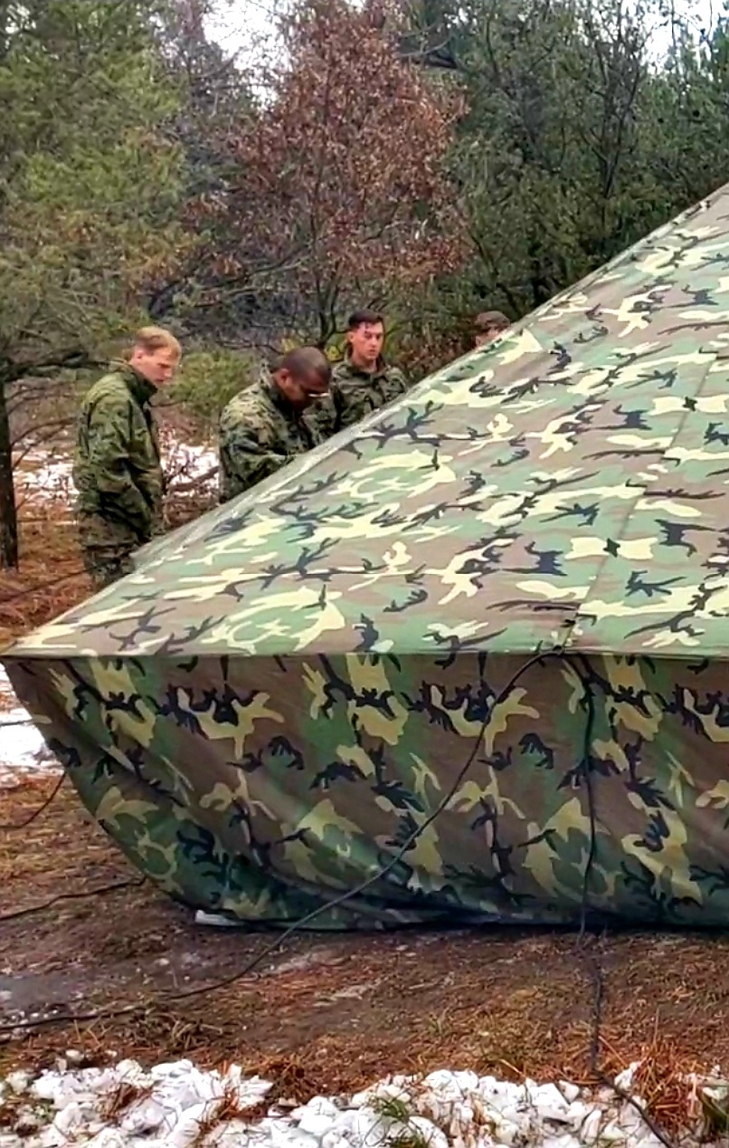 Marines practice building Arctic tent as part of CWOC Class 22-01 training