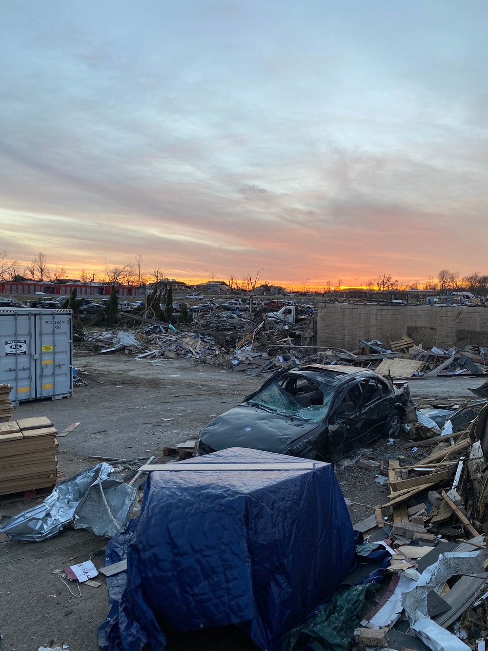 The Sun Sets Over Areas in Mayfield, Kentucky That Was Recently Hit By Tornadoes