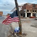 A Flag Blows in the Wind in Downtown Mayfield, Kentucky Were a Tornado Recently Ravished the Town
