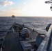 USS Ross replenishes at sea with USNS Supply