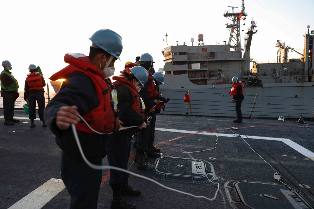 USS Ross replenishes at sea with USNS Supply