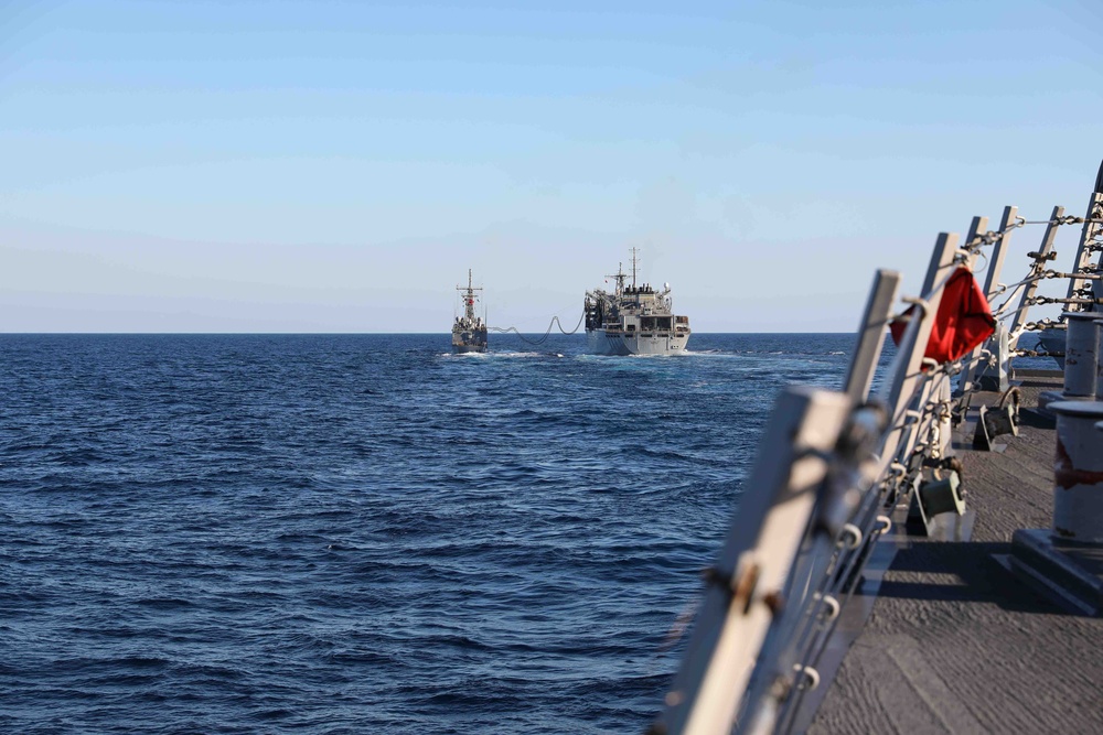 USS Ross replenishes at sea with USNS Supply