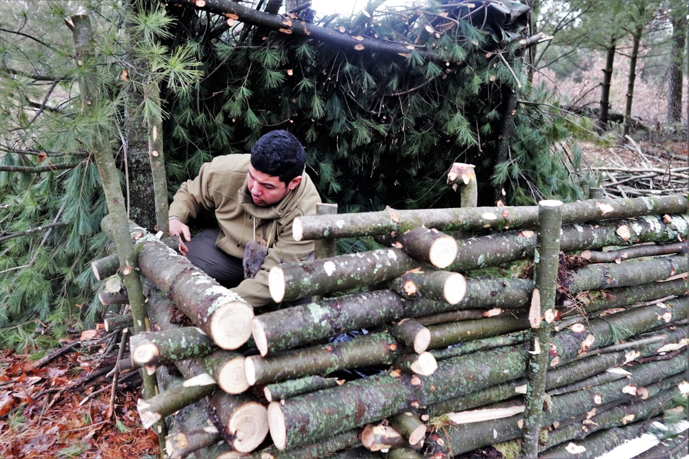 Building improvised shelters for Fort McCoy's Cold-Weather Operations Course