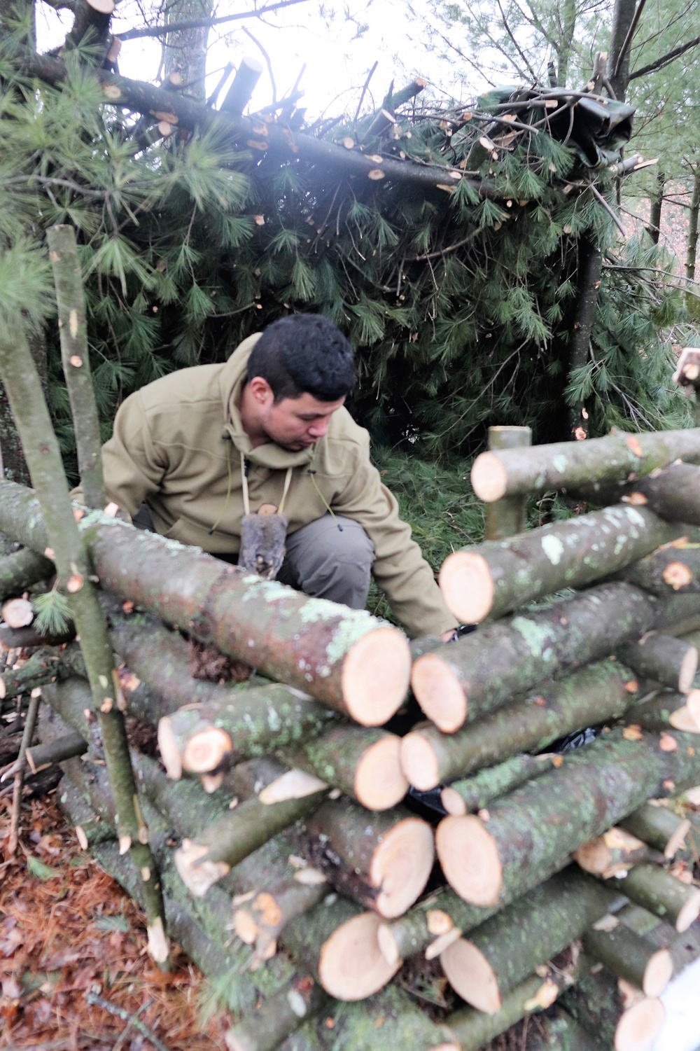 Building improvised shelters for Fort McCoy's Cold-Weather Operations Course