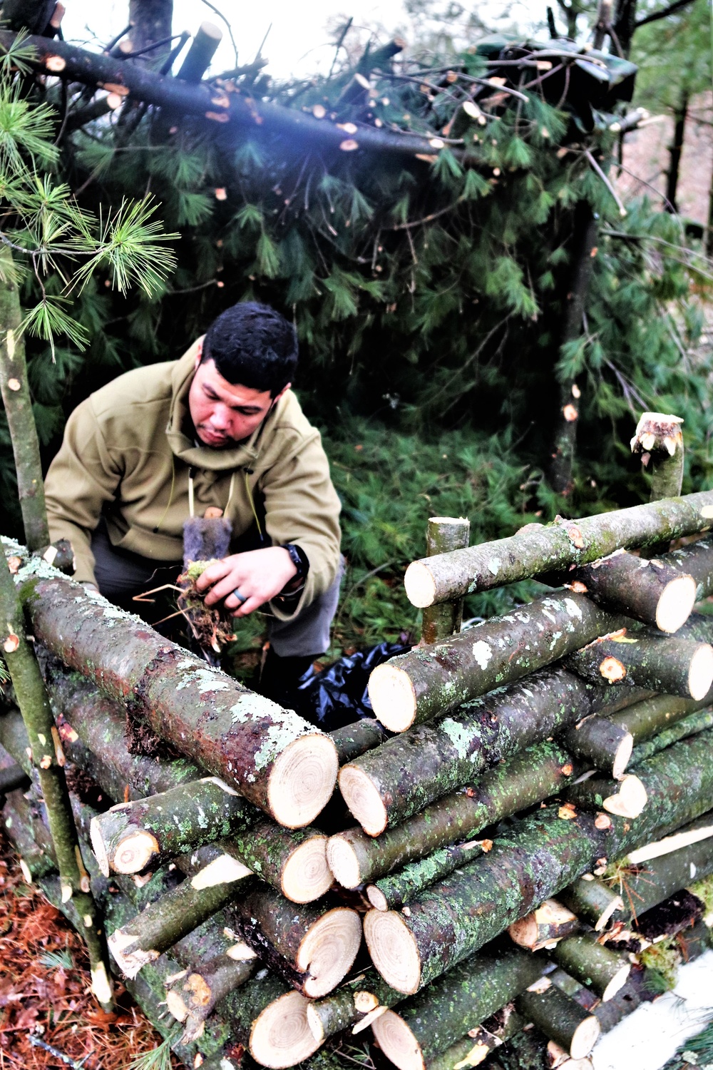 Building improvised shelters for Fort McCoy's Cold-Weather Operations Course