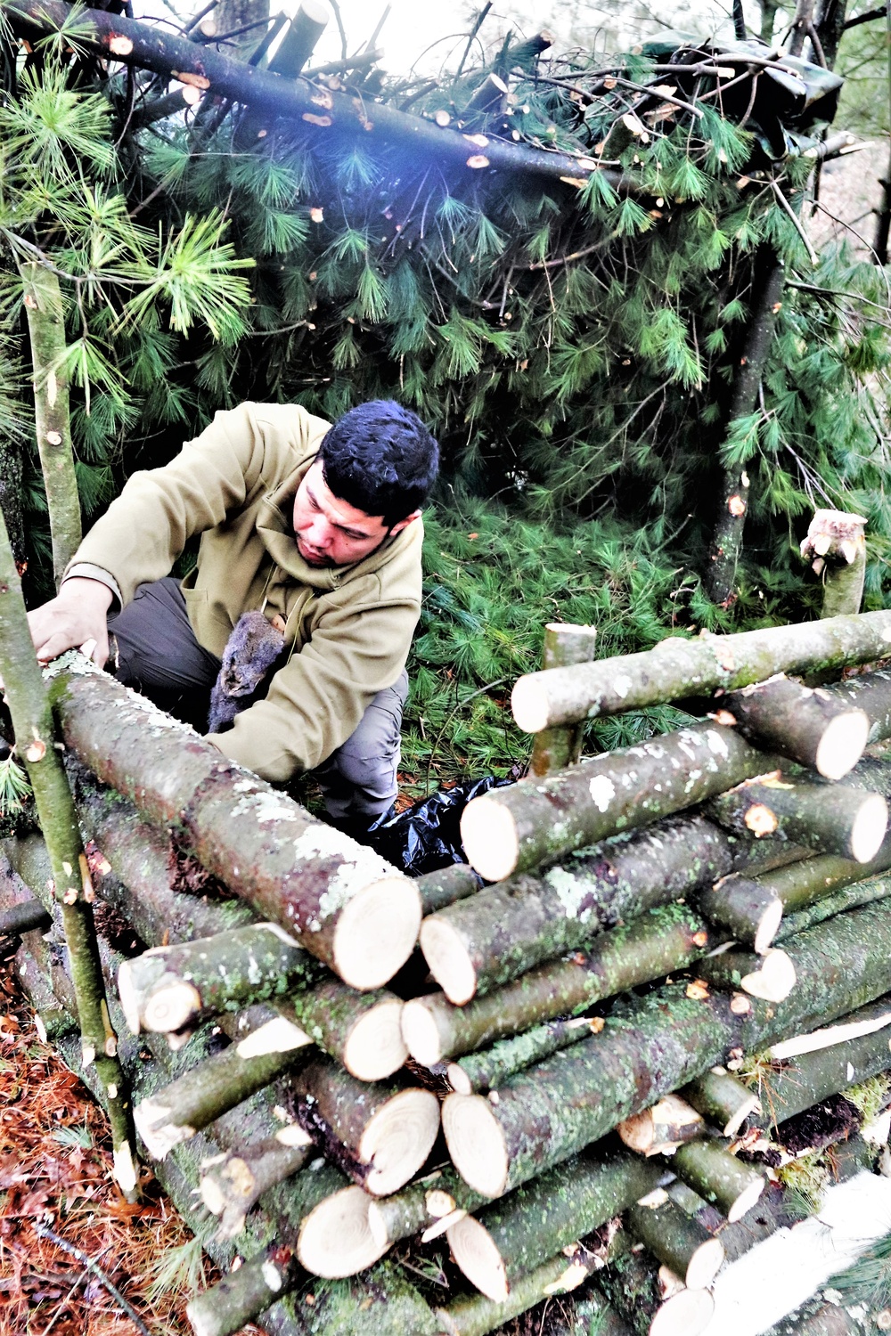 Building improvised shelters for Fort McCoy's Cold-Weather Operations Course