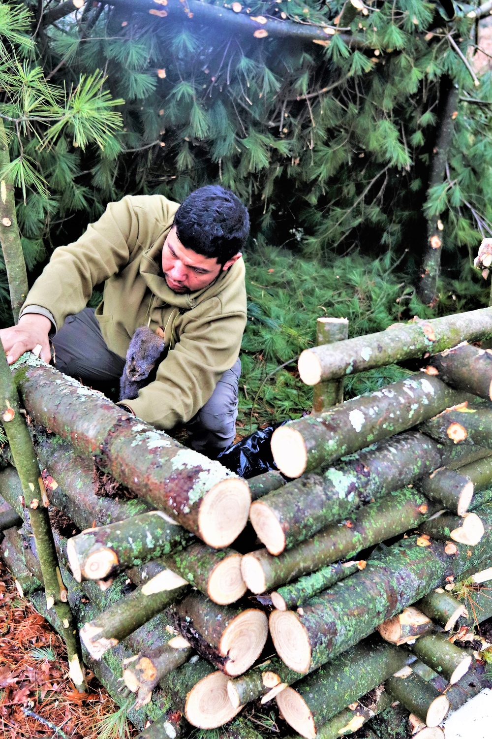 Building improvised shelters for Fort McCoy's Cold-Weather Operations Course