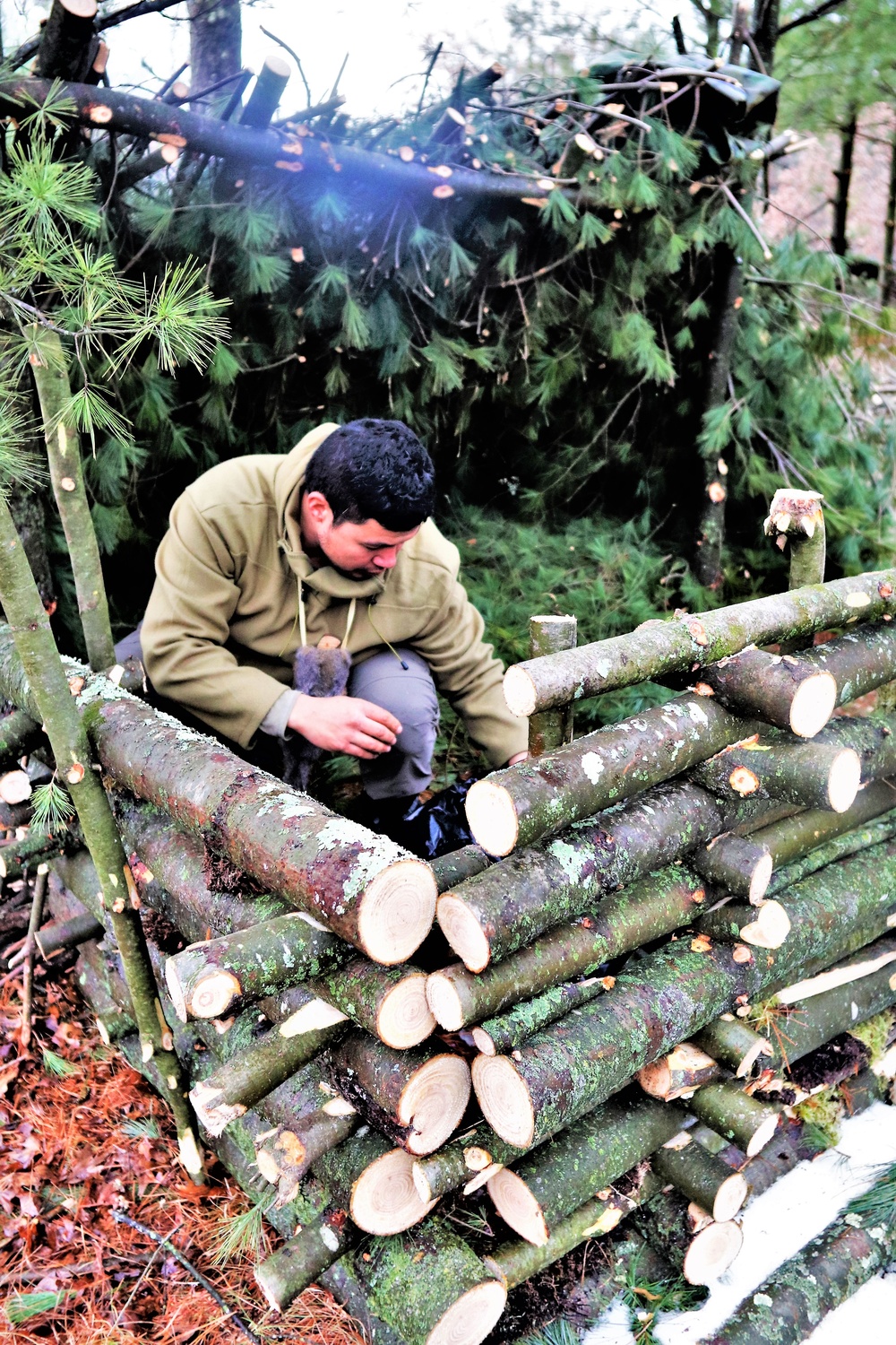 Building improvised shelters for Fort McCoy's Cold-Weather Operations Course