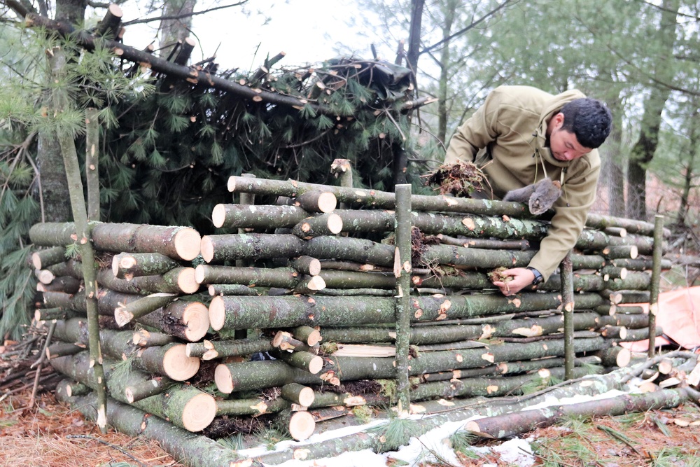 Building improvised shelters for Fort McCoy's Cold-Weather Operations Course