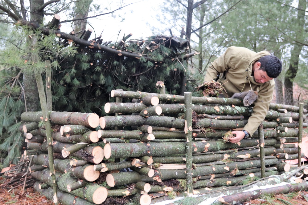 Building improvised shelters for Fort McCoy's Cold-Weather Operations Course