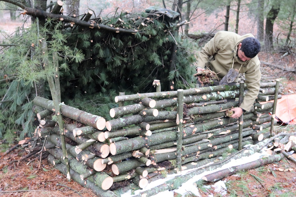 Building improvised shelters for Fort McCoy's Cold-Weather Operations Course