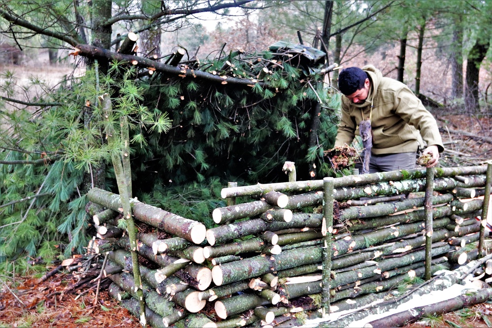 Building improvised shelters for Fort McCoy's Cold-Weather Operations Course