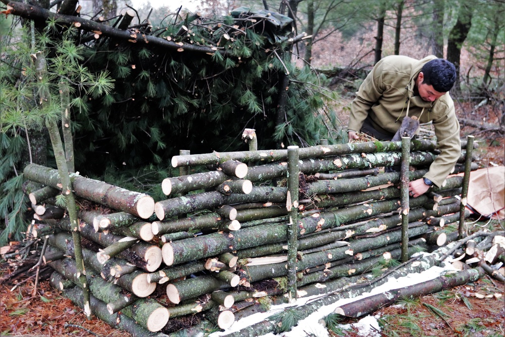 Building improvised shelters for Fort McCoy's Cold-Weather Operations Course