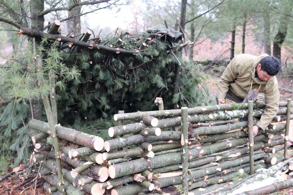 Building improvised shelters for Fort McCoy's Cold-Weather Operations Course