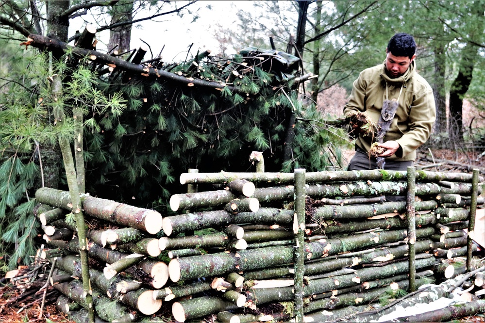 Building improvised shelters for Fort McCoy's Cold-Weather Operations Course