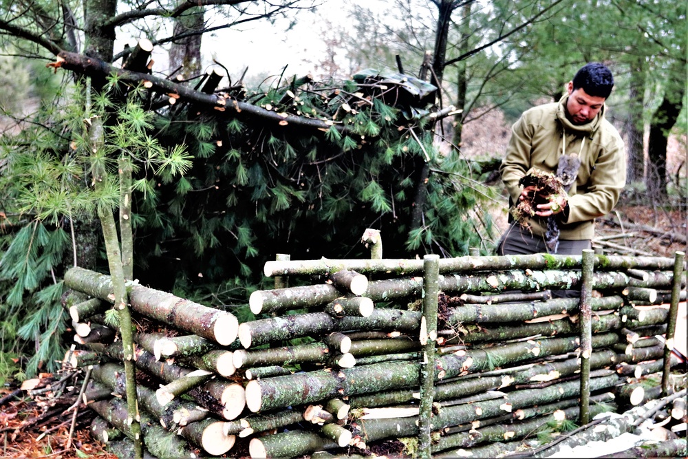 Building improvised shelters for Fort McCoy's Cold-Weather Operations Course