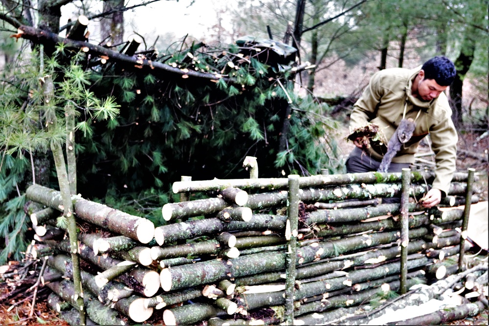 Building improvised shelters for Fort McCoy's Cold-Weather Operations Course