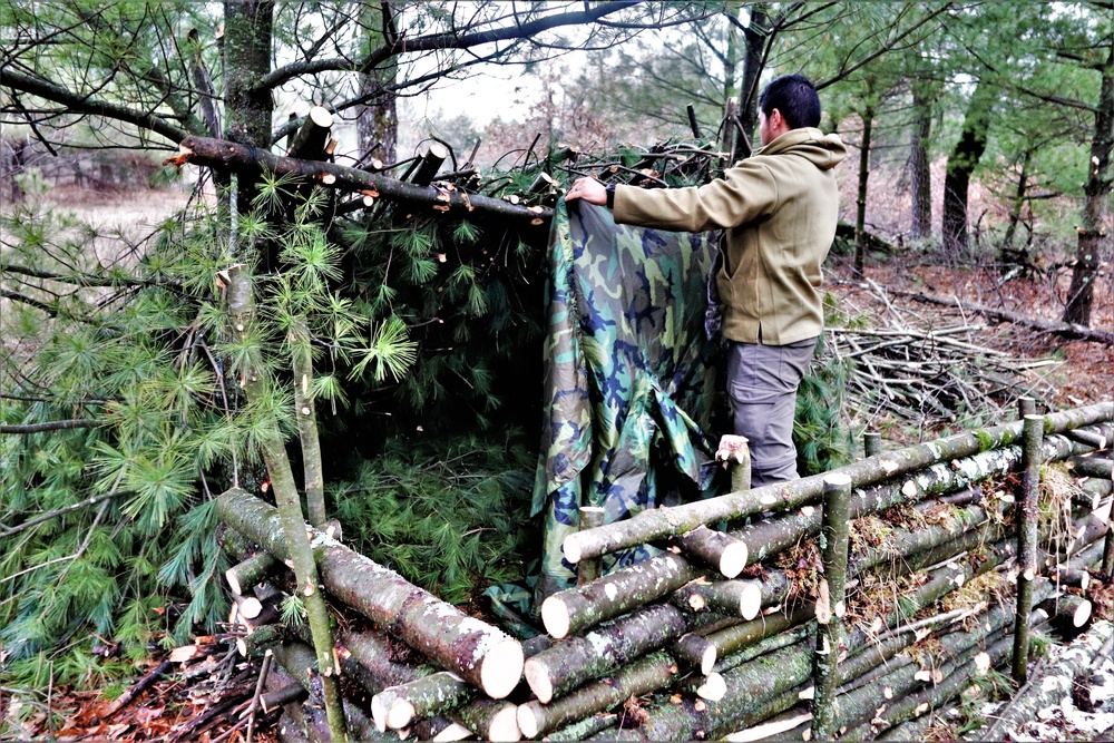 Building improvised shelters for Fort McCoy's Cold-Weather Operations Course