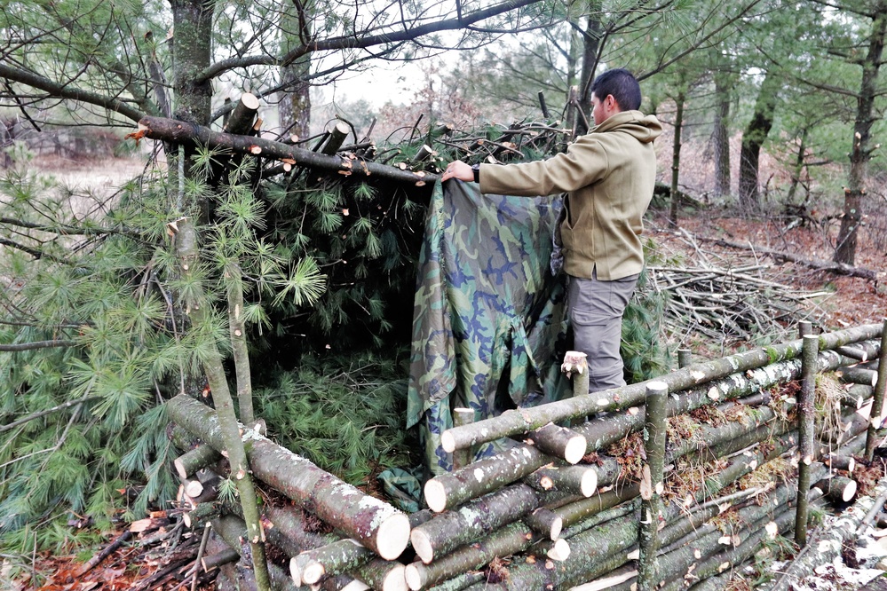 Building improvised shelters for Fort McCoy's Cold-Weather Operations Course