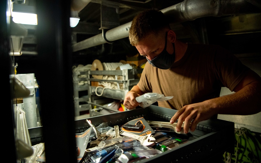 USS Charleston Sailor Conducts Tool Inspection